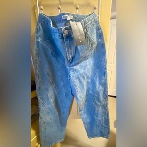 Lighter colored denim, extra wide leg jeans